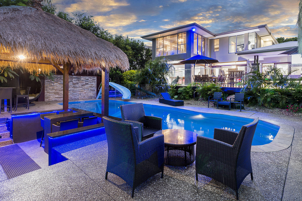 Renovated Helensvale home and pool at dusk